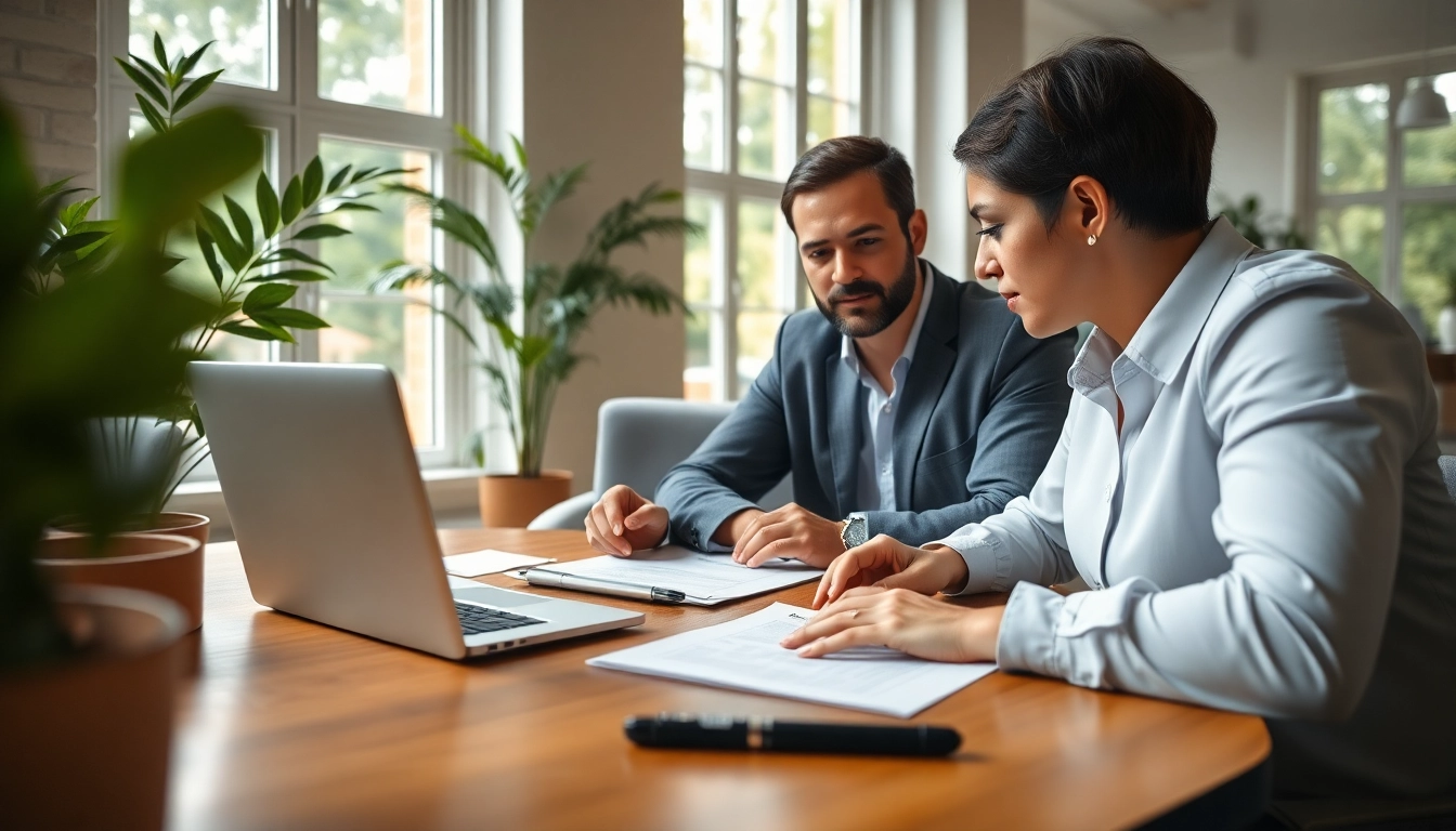 Couple reviewing Family Law Financial Agreements in a warm office, showcasing legal documents and a laptop.